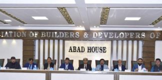 Syed Nasir Hussain Shah speaking to a meeting at ABAD House while Chairman ABAD M. Hassan Bakshi.