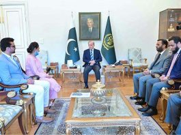 PM Shehbaz hands over Rs 10 mln cheque to nurse who saved newborn during PIMS fire